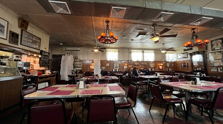 Which 11 Paterson Restaurants Made 2026’s Must-Eat List? Empty tables inside classic retro diner