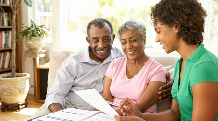 Who Can Get Up to $6,500 in Stay NJ Tax Relief This Year? Family reviewing paperwork on couch