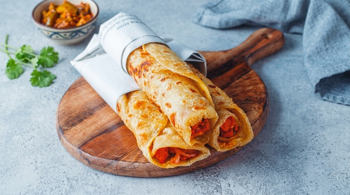 NYC’s Popular Indian Street Food Brand Expands to New Jersey! First Location Revealed Spicy chicken kathi rolls wrapped