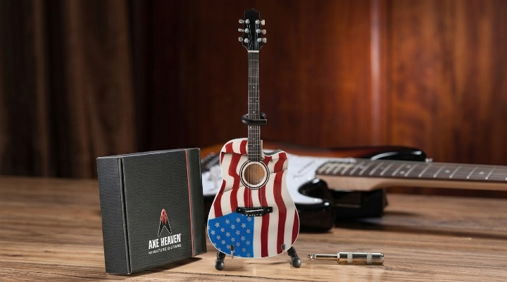 These 9 Rock Songs Sound Patriotic—But Their Real Meaning May Surprise You Miniature guitar painted like American flag